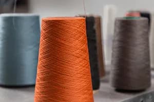 Filament yarn produced using recycled rPET flakes.